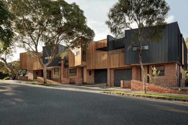 3 modern brown brick townhouses