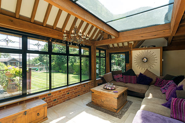 Cushioned benches in sunny conservatory