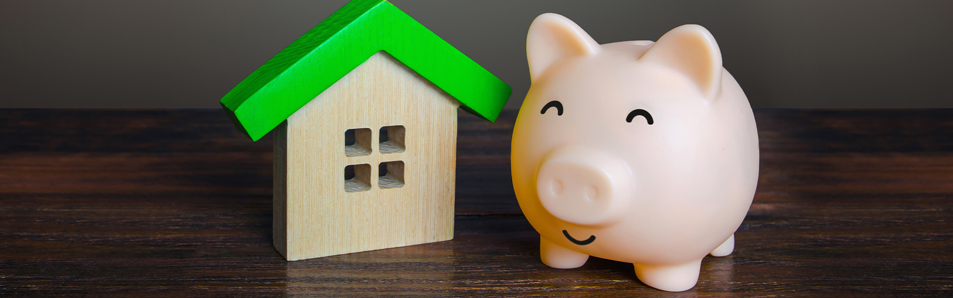 Piggy bank and house figure