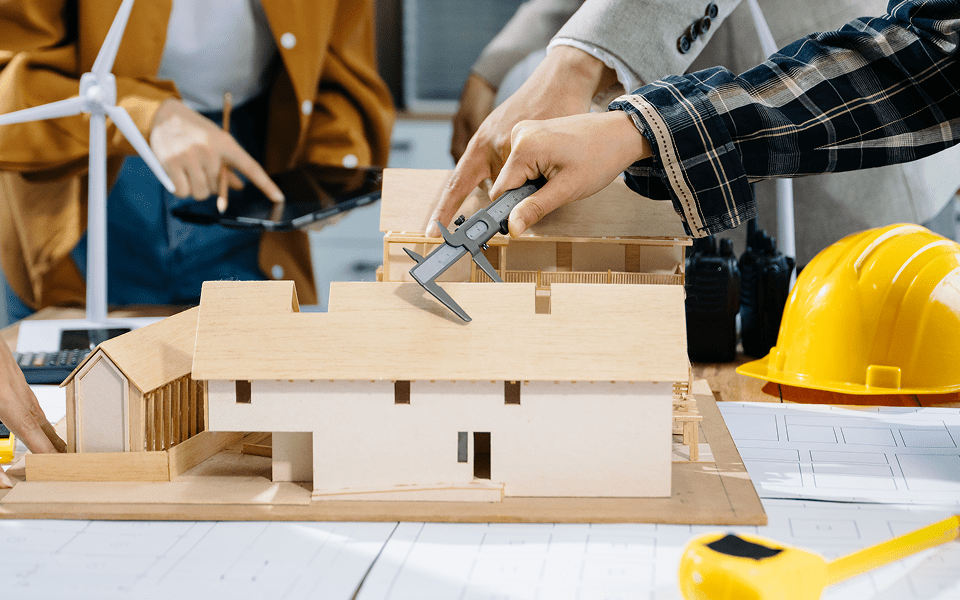 Architects working on a building diagram