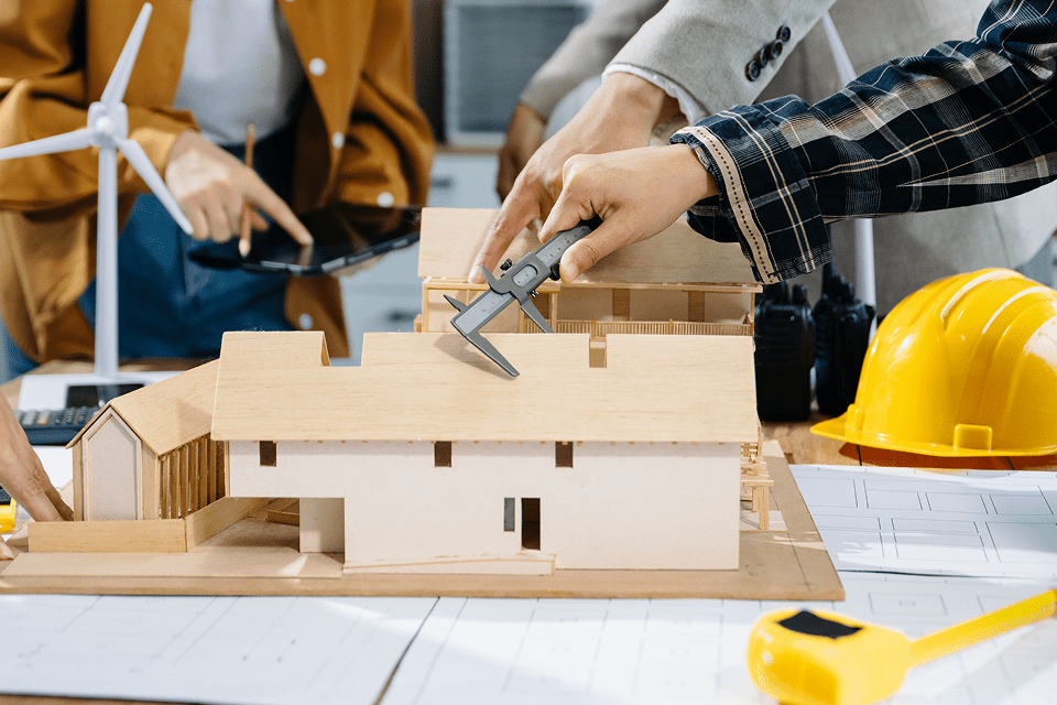 Architects working on a building diagram