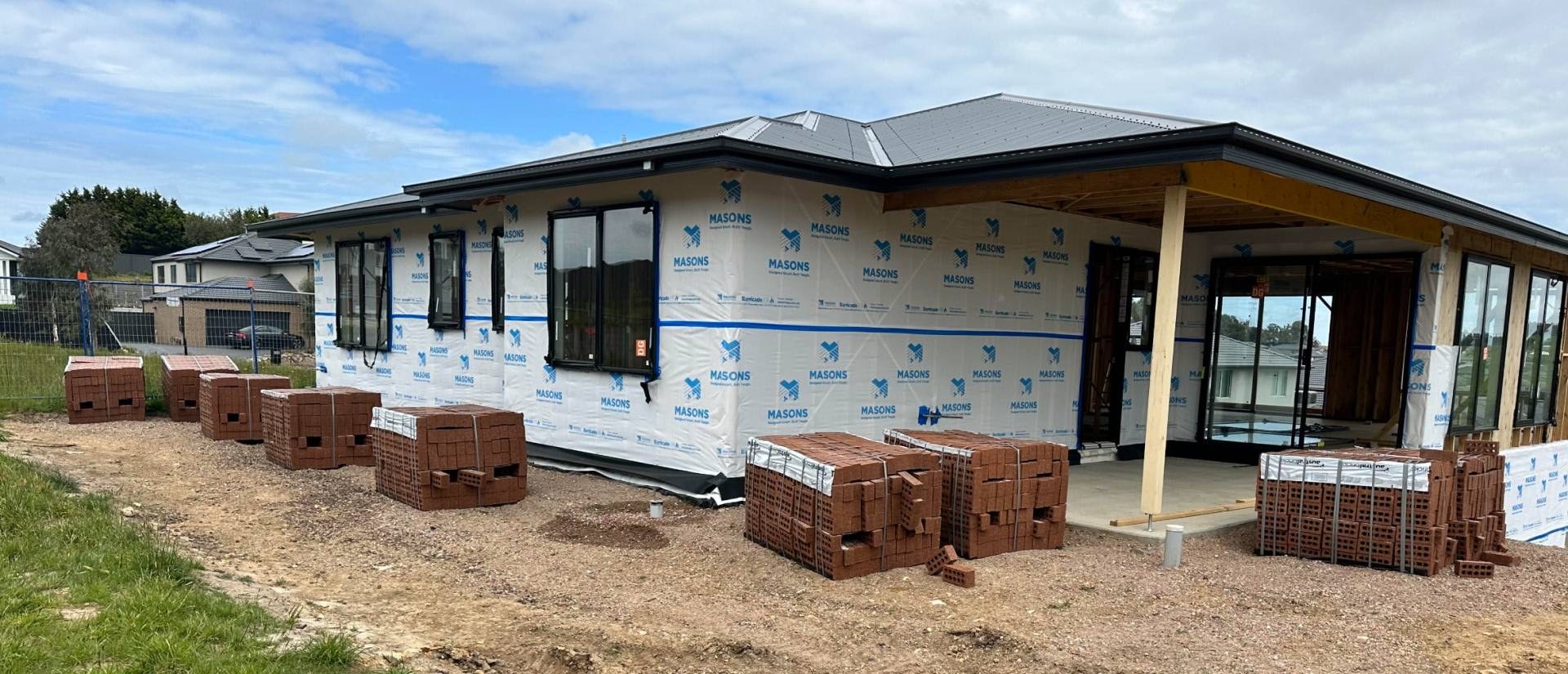 House mid construction, ready for brick wall exterior