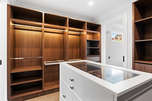 Walk in wardrobes with an island cabinet